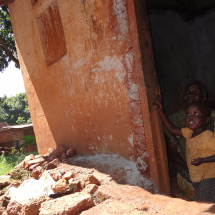 African mother and daughter in a hut